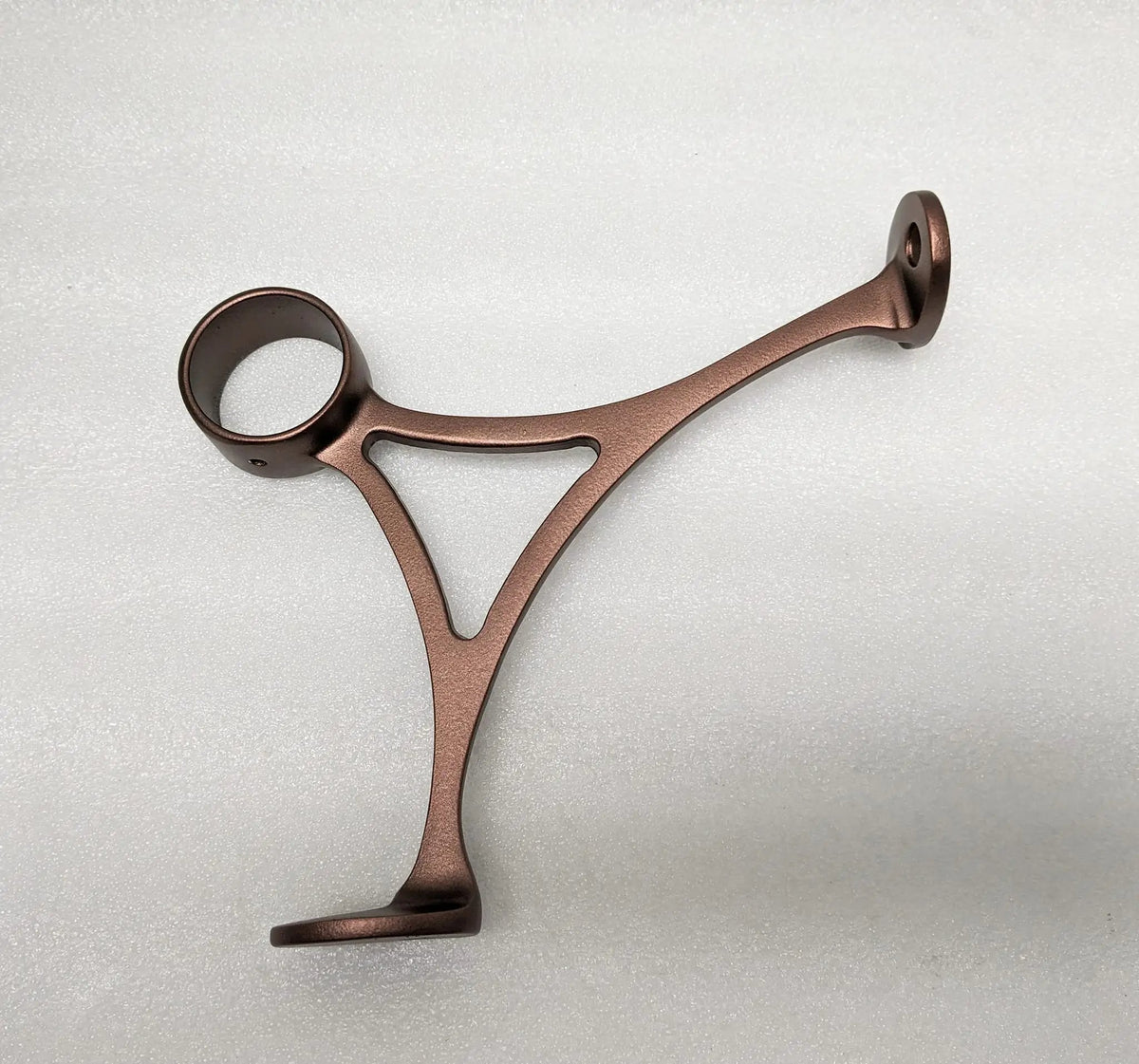 Combination bracket for foot rail with oil rubbed bronze finish